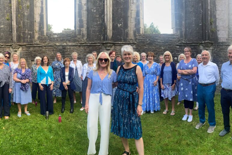 choir and leaders in a runined chapel