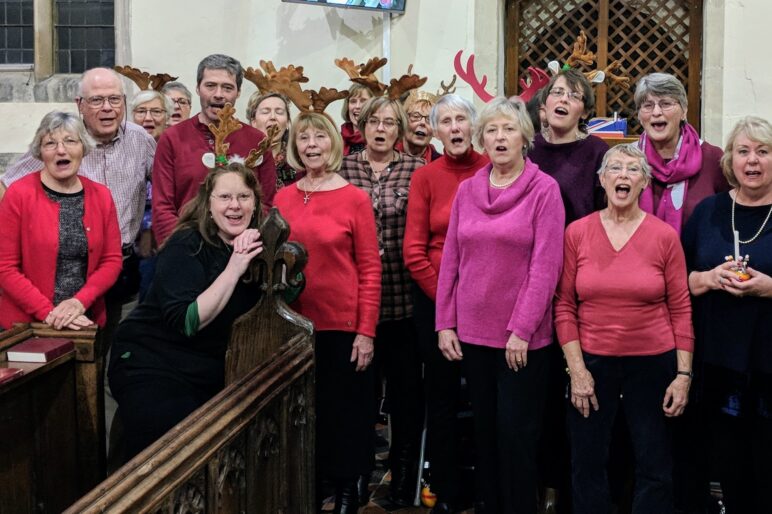 Choir in a church with Rudolph horns!