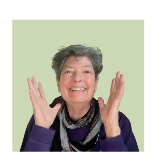 laura landy head and upper torso smiling, hands raised