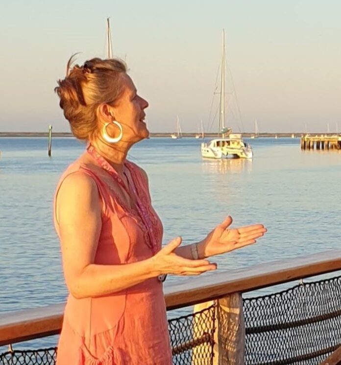Alice leading The Boathouse Choir on Nelson Haven.