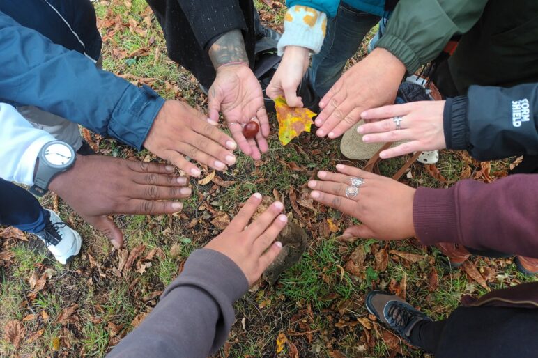 diverse hands in a circle